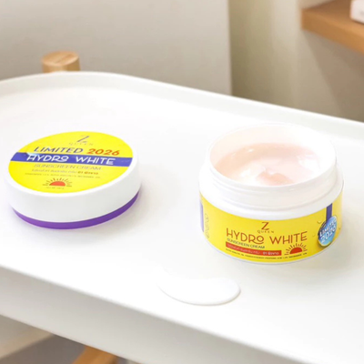 Hand applying Z Queen body sunscreen cream
