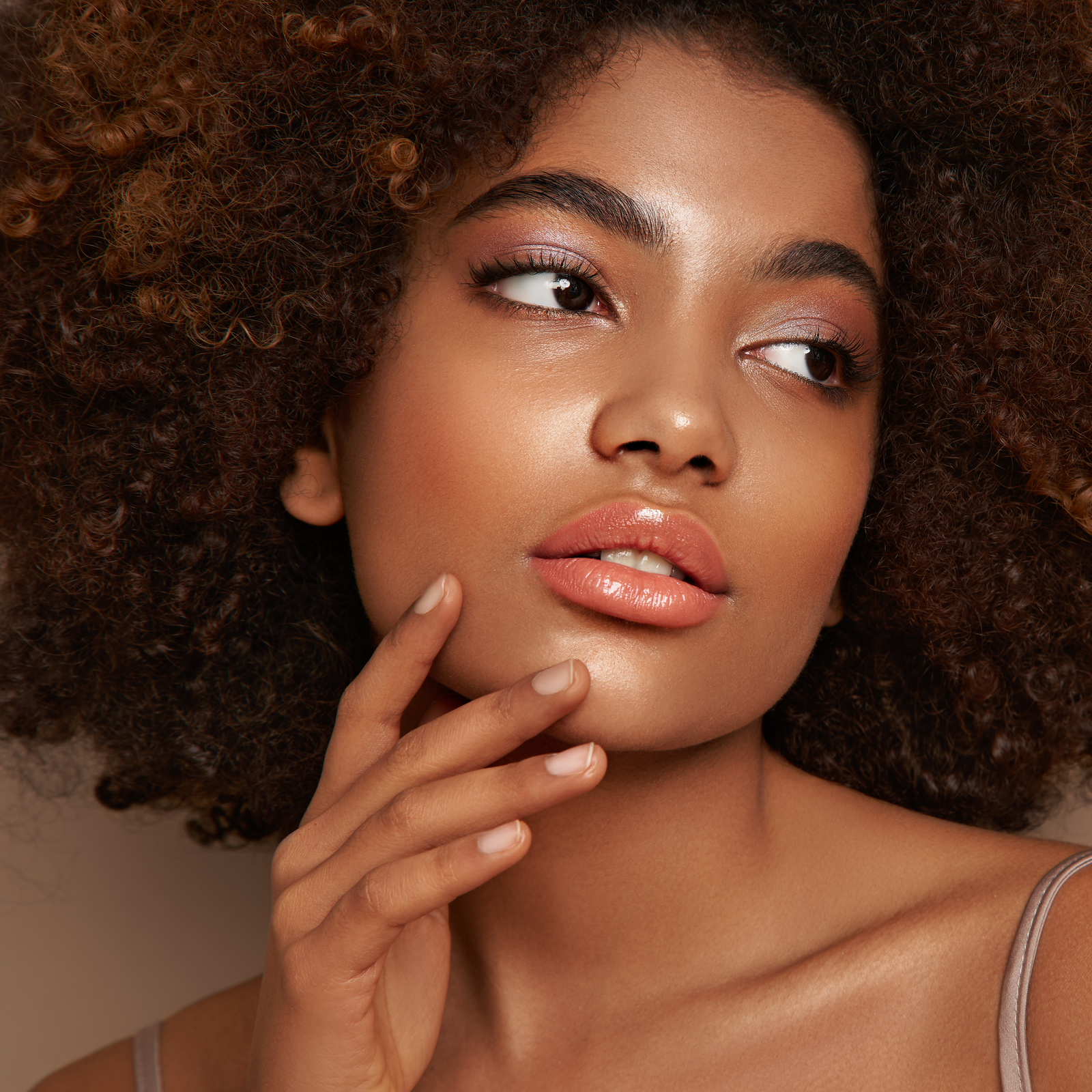 Woman showcasing a natural skincare routine for blemish-prone skin