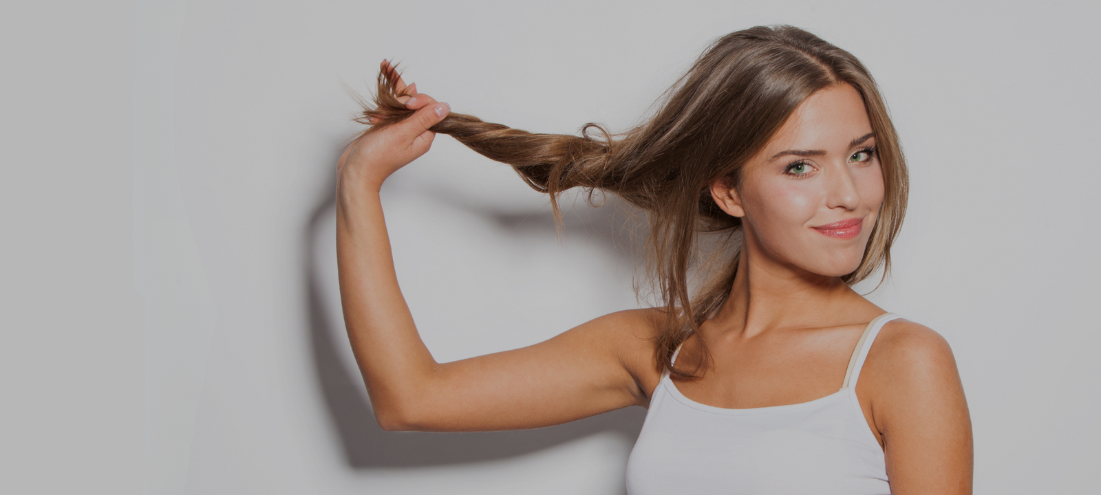 Woman showcasing healthy-looking hair as part of a hair care beauty routine