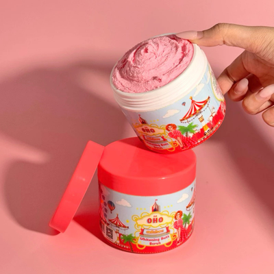 Scooping OHO Gluta Butt Scrub with wooden spoon